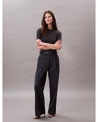 Calvin Klein - Pantalones holgados de sarga de algodón - Lyst