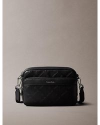 Calvin Klein - Embossed Emblem Crossbody Camera Bag - Lyst