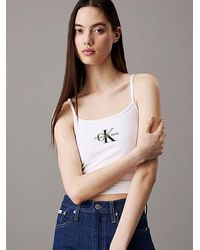 Calvin Klein - Top slim con monograma - Lyst