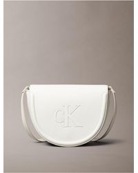 Calvin Klein - Embossed Monogram Logo Saddle Bag - Lyst