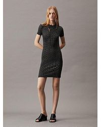 Calvin Klein - Schmales geripptes Kleid mit durchgängigem Logo-Print - Lyst