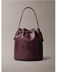 Calvin Klein - Embossed Monogram Logo Bucket Bag - Lyst