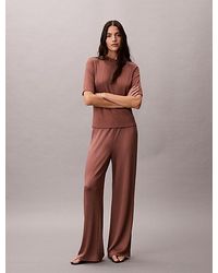 Calvin Klein - Shiny Ribbed Pull On Trousers - Lyst