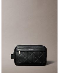 Calvin Klein - Embossed Allover Emblem Logo Wash Bag - Lyst