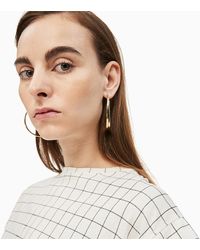 Calvin Klein Pendientes - Groovy - Metálico