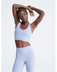 Calvin Klein Women's Premium Performance Moisture Wicking Medium Impact  Reversible Sports Bra - ShopStyle
