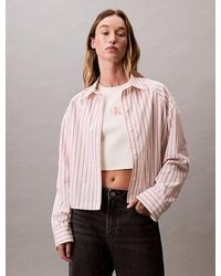 Calvin Klein - Camisa con botones boxy cropped a rayas - Lyst