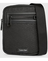 Calvin Klein - Kleine wendbare Reporter-Bag mit Logo - Lyst