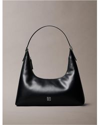 Calvin Klein - Monogram Logo Emblem Leather Shoulder Bag - Lyst