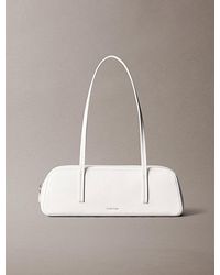 Calvin Klein - Glossy Foil Logo Bauletto Shoulder Bag - Lyst