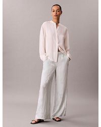 Calvin Klein - Viscose Jacquard Floral Trousers - Lyst
