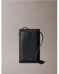 Calvin Klein Monogram Logo Flap Phone Crossbody Bag in Black