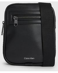 Calvin Klein - Kleine Crossbody-Reporter-Bag mit Logo - Lyst
