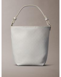 Calvin Klein - Allover Emblem Logo Bucket Bag - Lyst