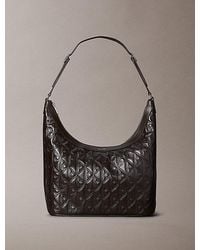 Calvin Klein - Debossed Allover Emblem Logo Shoulder Bag - Lyst