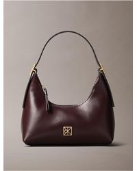 Calvin Klein - Monogram Logo Emblem Leather Small Shoulder Bag - Lyst
