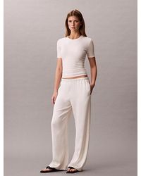 Calvin Klein - Hammered Satin Textured Trousers - Lyst