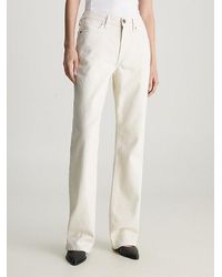 Calvin Klein - Mid Rise Relaxed Bootcut Jeans - Lyst