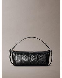 Calvin Klein - Debossed Allover Emblem Logo Long Shoulder Bag - Lyst