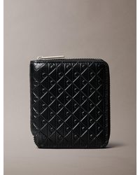 Calvin Klein - Embossed Allover Monogram Zip Bifold Wallet - Lyst