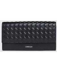 Calvin Klein - Cartera grande acolchada de plegado triple con RFID - Lyst