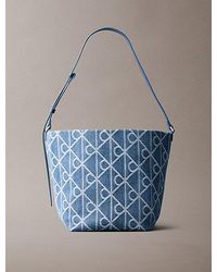 Calvin Klein - Denim Allover Emblem Logo Bucket Bag - Lyst