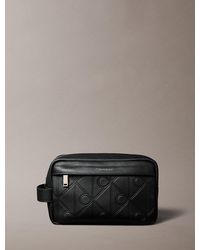 Calvin Klein - Embossed Allover Emblem Logo Wash Bag - Lyst