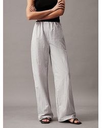 Calvin Klein - Pantalones Parachute holgados - Lyst
