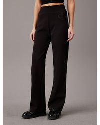 Calvin Klein - Pantalon de jogging évasé avec monogramme - Lyst