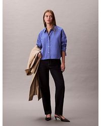 Calvin Klein - Camisa con botones boxy cropped a rayas - Lyst