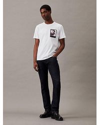 Calvin Klein - T-Shirt mit Blumen-Grafik - Lyst
