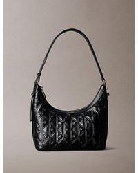 Calvin Klein - Debossed Allover Emblem Logo Small Shoulder Bag - Lyst