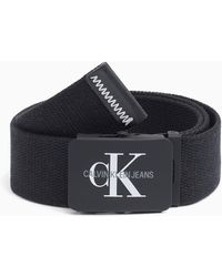 Calvin Klein Cintur�n de lona con placa - Negro