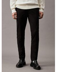 Calvin Klein - Chinos slim con cinturón - Lyst
