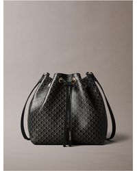 Calvin Klein - Emblem Logo Drawstring Bucket Bag - Lyst