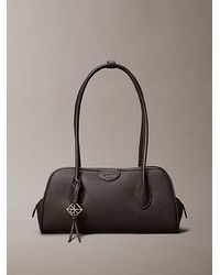 Calvin Klein - Emblem Logo Pebble Shoulder Bag - Lyst