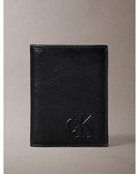 Calvin Klein - Embossed Monogram Bifold Wallet - Lyst