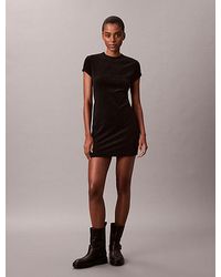 Calvin Klein - Jeans Velour Embossed Logo Graphic Mini Dress - Lyst