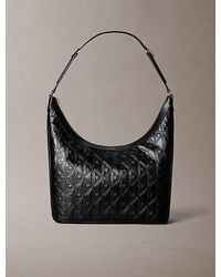 Calvin Klein - Debossed Allover Emblem Logo Shoulder Bag - Lyst
