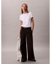 Calvin Klein - Camiseta con logo metálico brillante - Lyst