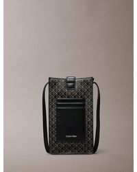 Calvin Klein - Allover Emblem Logo Phone Crossbody Bag - Lyst
