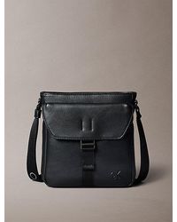 Calvin Klein - Pebbled Logo Strap Crossover Flight Bag - Lyst