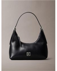 Calvin Klein - Monogram Logo Emblem Leather Small Shoulder Bag - Lyst
