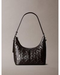Calvin Klein - Debossed Allover Emblem Logo Small Shoulder Bag - Lyst