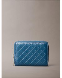 Calvin Klein - Embossed Allover Monogram Zip Coin Pouch - Lyst