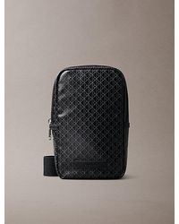 Calvin Klein - Allover Emblem Logo Square Sling Bag - Lyst