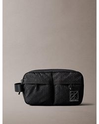 Calvin Klein - Allover Emblem Logo Jacquard Wash Bag - Lyst