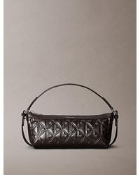 Calvin Klein - Debossed Allover Emblem Logo Long Shoulder Bag - Lyst