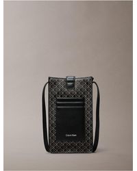 Calvin Klein - Allover Emblem Logo Phone Crossbody Bag - Lyst