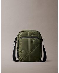 Calvin Klein - Gesteppte Reporter Bag Mit Monogramm-Logo - Lyst